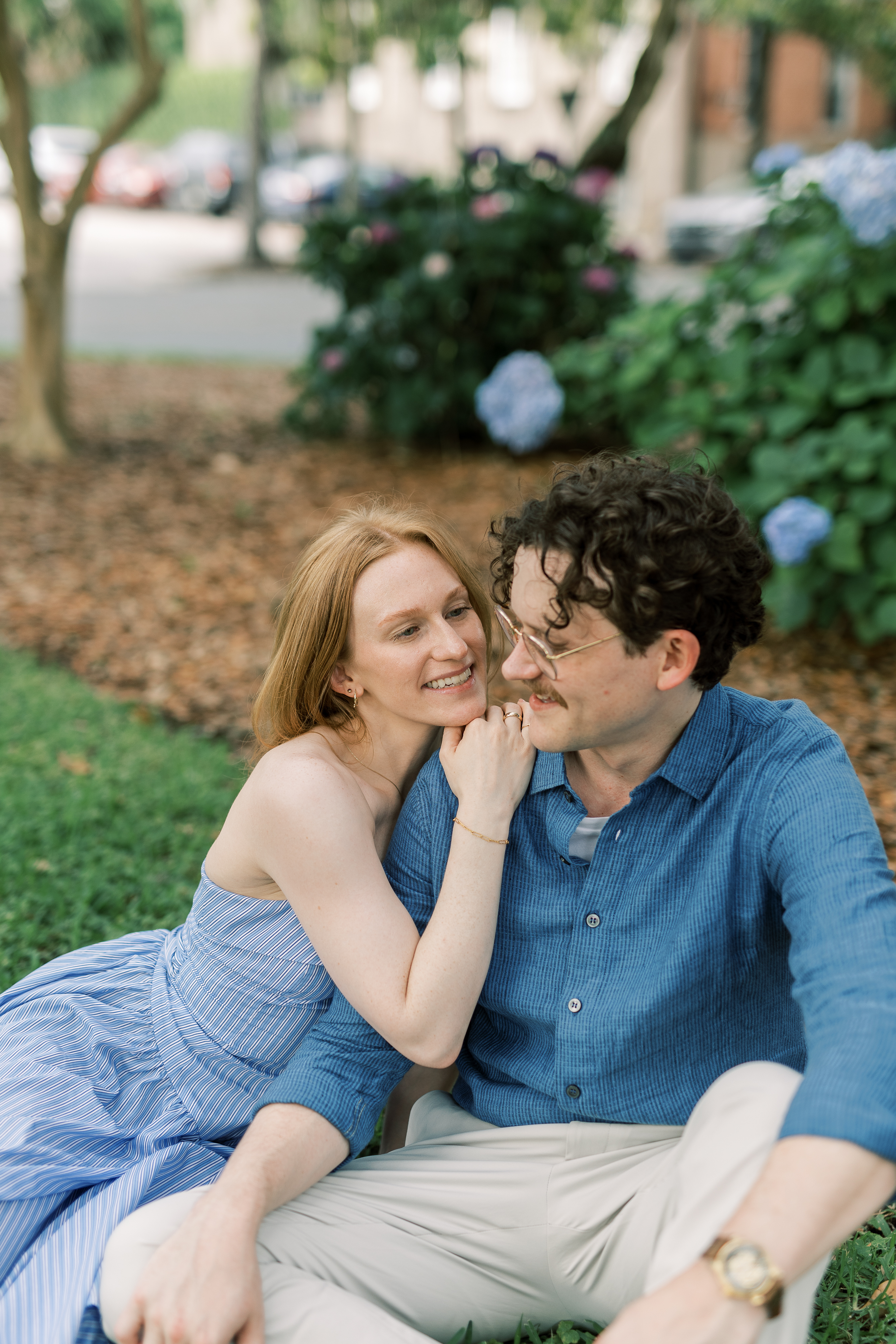 Morgan and Brendan during a quiet engagement moment outdoors