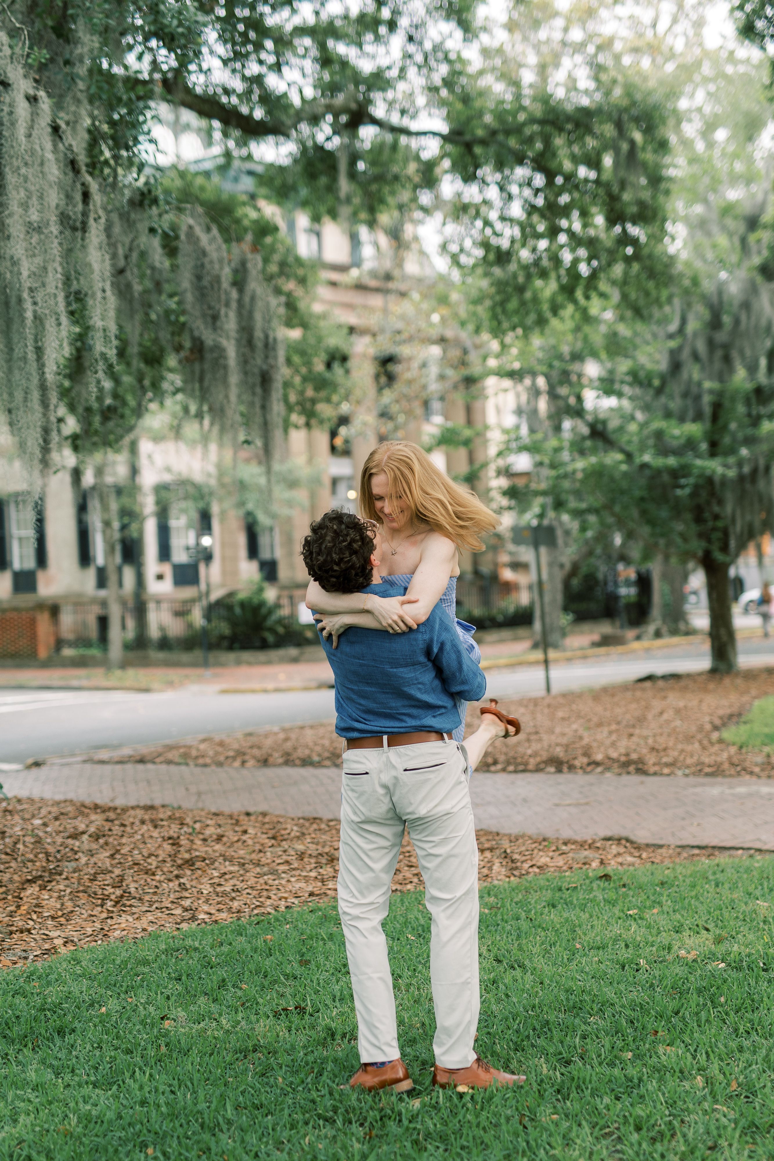 Morgan and Brendan smiling in a formal engagement portrait